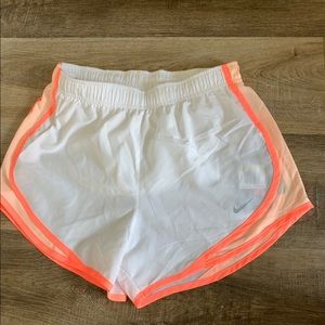 Orange and white Nike shorts